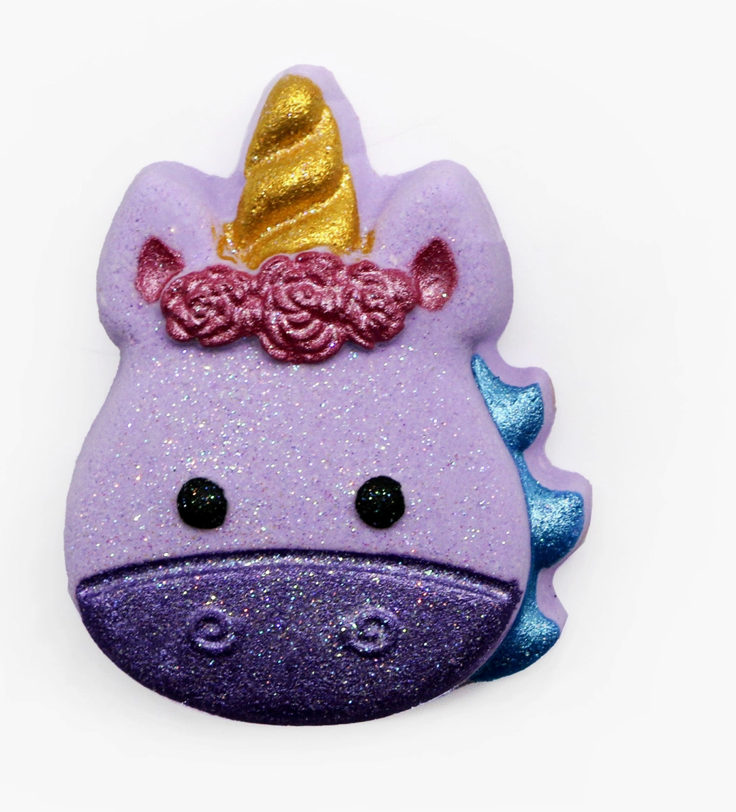 “Purple, pink, and blue unicorn bath bomb fizzing in tub — grape and vanilla candy scent, handmade boutique gift.”
