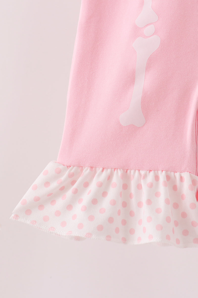 Pink skeleton print ruffle romper