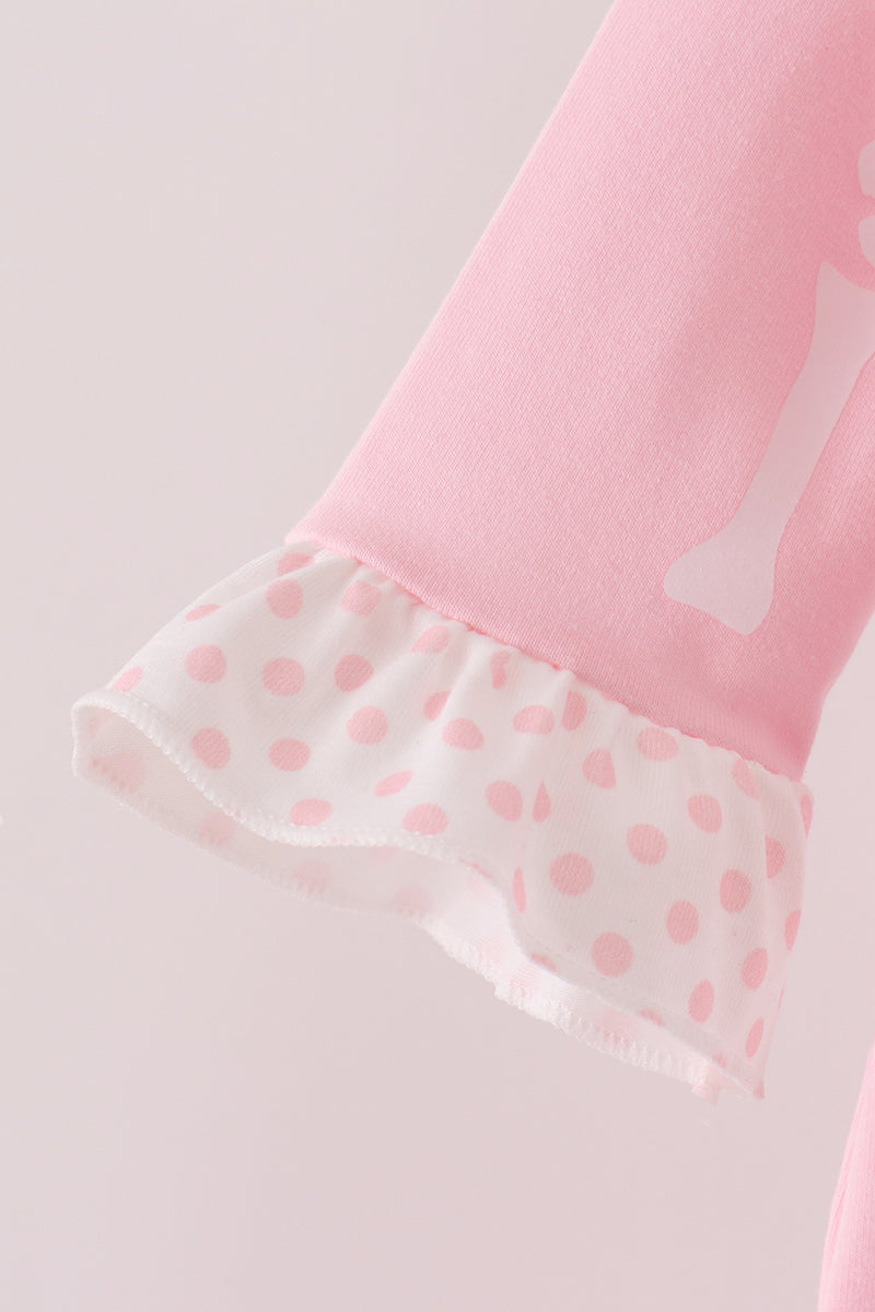 Pink skeleton print ruffle romper