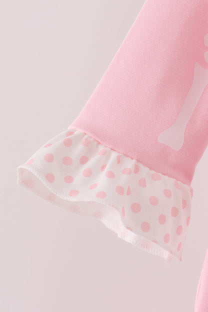Pink skeleton print ruffle romper
