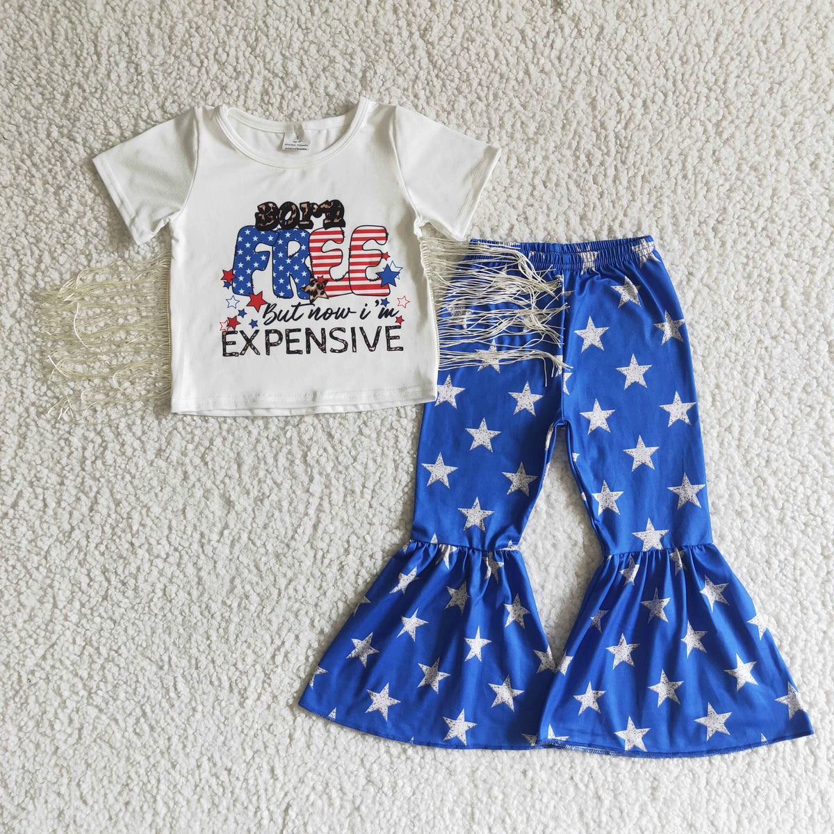Born free but now in expensive white T-shirt bell bottom pants set