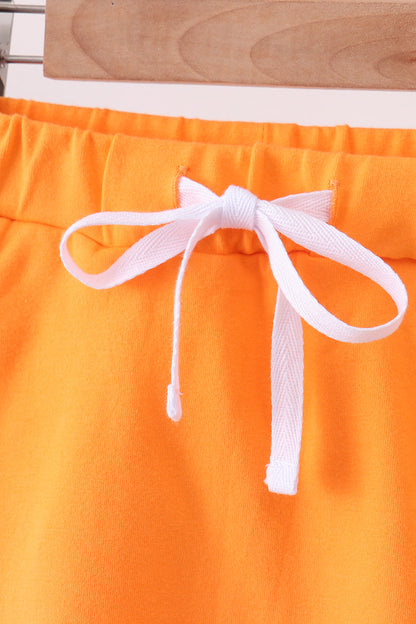 Orange scallop hem bow skort