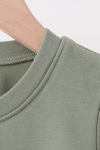 Green pumpkin french knot top