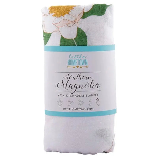 Little Hometown Southern Magnolia 47 x 47 bamboo swaddle blanket featuring oversized white magnolia flowers on a soft bamboo muslin fabric.